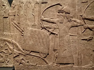 Assyrian relief of attack on an enemy town during the reign of Tiglath-Pileser III 720-743 BCE from his palace at Kalhu (Nimrud)